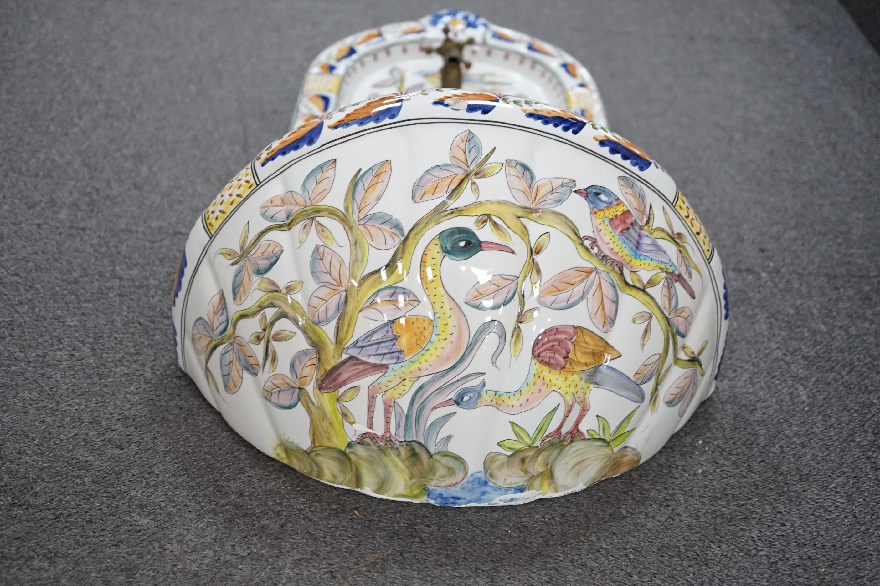 A Portuguese pottery font and basin, hand painted with birds and flowers, 66cm high